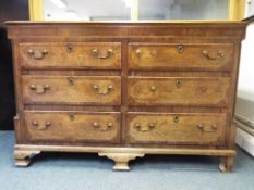 A good quality oak and inlaid chest of six drawers, approximately 110 cm x 155 cm x 54 cm.