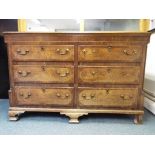 A good quality oak and inlaid chest of six drawers, approximately 110 cm x 155 cm x 54 cm.