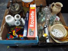 Two boxes containing a mixed lot to include collectable glass bottles, diecast car,
