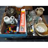 Two boxes containing a mixed lot to include collectable glass bottles, diecast car,