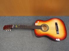 A good quality beginners acoustic guitar - This lot MUST be paid for and collected,