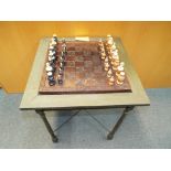 A table in the form of a chess board and card table with inset drawers containing ebony and ivory