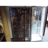 Two display cabinets with glass doors and shelves.