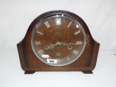 An oak cased Smiths mantel clock with pendulum and key - This lot MUST be paid for and collected,