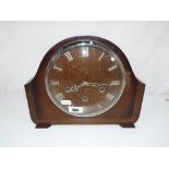 An oak cased Smiths mantel clock with pendulum and key - This lot MUST be paid for and collected,
