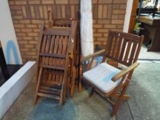 A set of six good quality wooden garden chairs with upholstered seats and a matching parasol - This