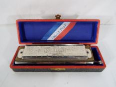 A Hohner Super Chromonica chromatic harm