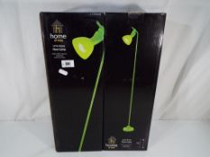 Two lime coloured floor lamps from Home