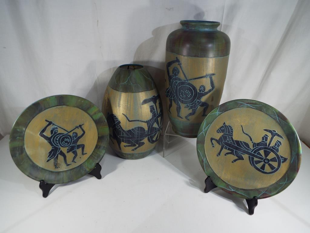 Four pieces of matching Egyptian style ceramics to include vases and plates,