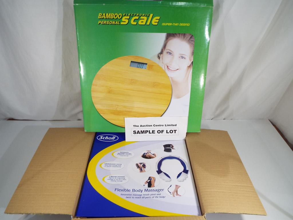 Seven Scholl flexible body massagers and two electronic bathroom scales decorated with a bamboo