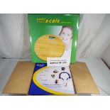 Seven Scholl flexible body massagers and two electronic bathroom scales decorated with a bamboo