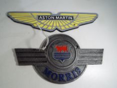 Two cast iron advertising signs entitled Aston Martin 8.5 cm x 13.5 cm and Morris 15 cm x 18 cm.