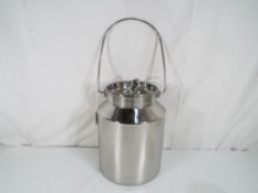 A five litre stainless steel churn and lid inscribed DHARA 26cm (h) Est £20 - £30 - This lot MUST