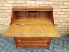 An oak bureau, 91 cm x 81 cm x 45 cm - This lot MUST be paid for and collected,