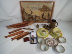 A good mixed lot to include an Australian tree bark picture framed under glass, wooden carvings,