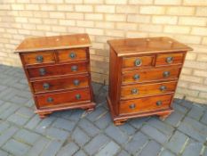 A pair of matching bedside drawers,
