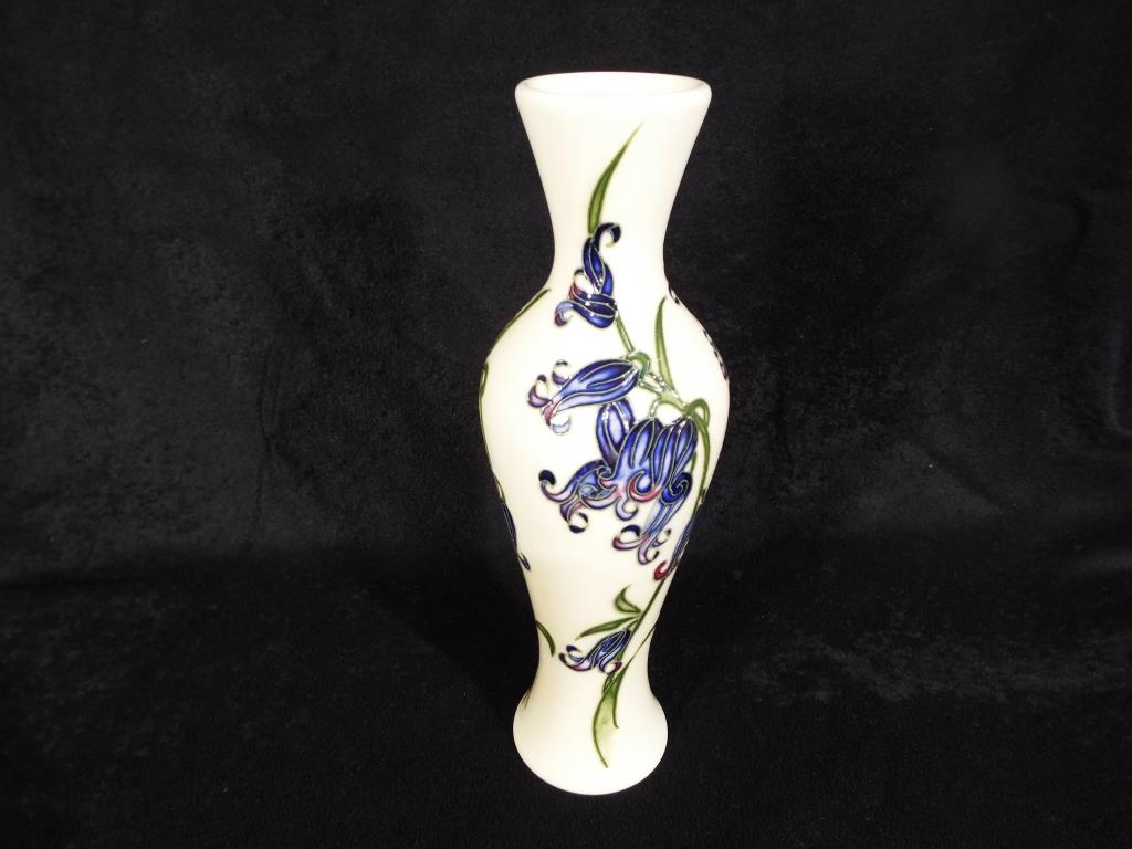 Moorcroft Pottery - a slimline vase decorated with Bluebells,