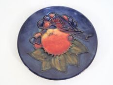 Moorcroft Pottery - A pin dish by Moorcroft Pottery in the Finches and Fruit pattern on a blue