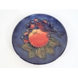 Moorcroft Pottery - A pin dish by Moorcroft Pottery in the Finches and Fruit pattern on a blue