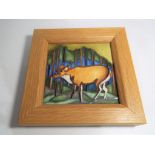 Moorcroft Pottery - a framed square plaque depicting a stag in the woods, Trial piece dated 17/3/15,