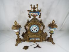 A late 19th century French clock garniture du cheminee,