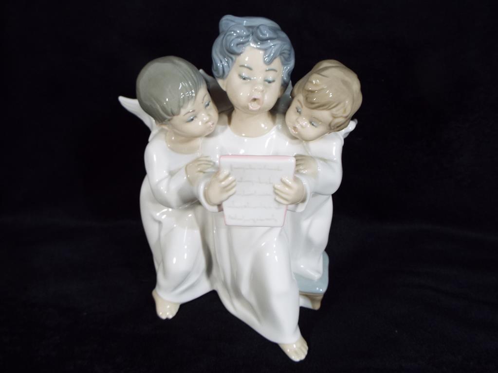 Lladro - a Lladro figurine group entitled Angels Group depicting three angels singing,