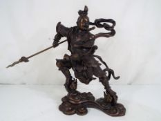 A Chinese bronze sculpture depicting Nezha, approximately 25 cm (h).