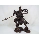 A Chinese bronze sculpture depicting Nezha, approximately 25 cm (h).