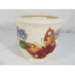 Moorcroft - a Moorcroft pottery jardiniere in the Butterfly pattern on a pale ground,