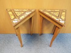 Two small triangular topped tables with inlaid decoration and musical movements,