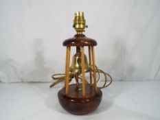 A good quality wood and brass table lamp in the form of a buoy with enamel insert bearing the P & O