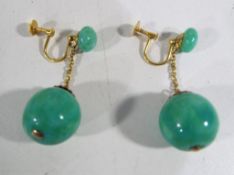 A pair of lady's 9 carat gold and green stone/marble/glass earrings - This lot MUST be paid for and