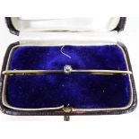 A 15 carat gold bar brooch set with solitaire diamond in case, approx weight 2.