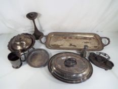 A good lot to include a quantity of plated ware and brass candlesticks - This lot MUST be paid for