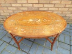 A good quality satin wood coffee table with inlay,