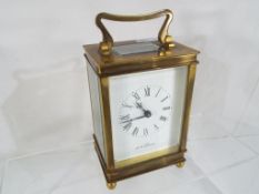 A brass cased carriage clock, the dial scribed 'De la Grense' Roman numerals,