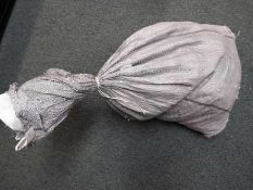 A large sack containing approximately 23 kg of unsorted costume jewellery.
