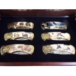 Franklin Mint - six Franklin Mint Collector Knives in mahogany display case.