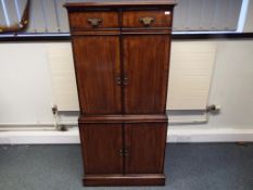 A good quality wooden cabinet with inlaid decoration to contain TV and DVD player 138cm x 65cm x
