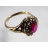 A lady's good quality 9 carat gold diamond and garnet cluster ring stamped 9ct,