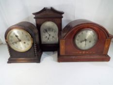 Three mantel clocks each with pendulum to include an inlaid mahogany cased clock by