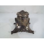 A good quality art nouveau white metal inkwell with floral decoration - This lot MUST be paid for