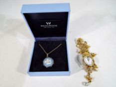 A decorative Kirks Folly lady's wristwatch and a Wedgwood Jasperware pendant and chain in original