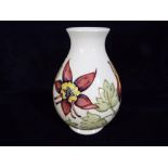 Moorcroft Pottery - a large bulbous vase decorated with Columbine on an ivorine ground,