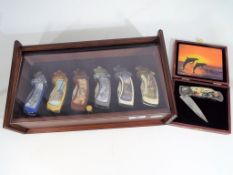 Franklin Mint - six Franklin Mint Collector Knives depicting wolves in mahogany display case and