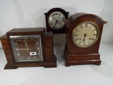 Three mantel clocks to include an early 20th century mahogany cased clock with circular silvered