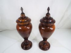 A pair of vintage fruit wood lidded urns 41cm (h) Est £60 - £80 - This lot MUST be paid for and