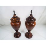 A pair of vintage fruit wood lidded urns 41cm (h) Est £60 - £80 - This lot MUST be paid for and