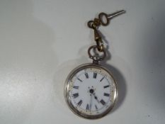 A lady's silver cased pocket watch, Roman numerals on a white dial, inscribed to the case 800,
