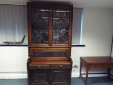 A good quality Edwardian walnut secretaire bookcase with astral glazed double doors,